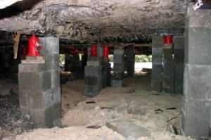 This photos shows the elevation of a concrete slab foundation and the home above the Base Flood Elevation.