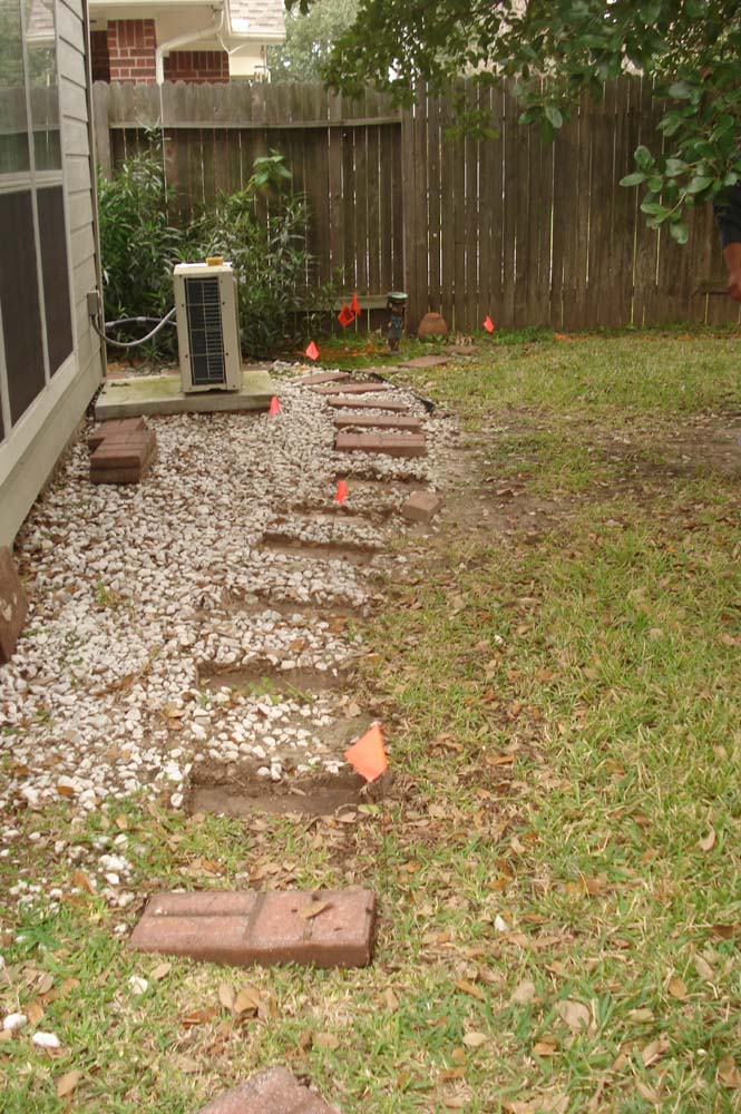 Marking the path of the trench for the root barricade - Plano Foundation Repair