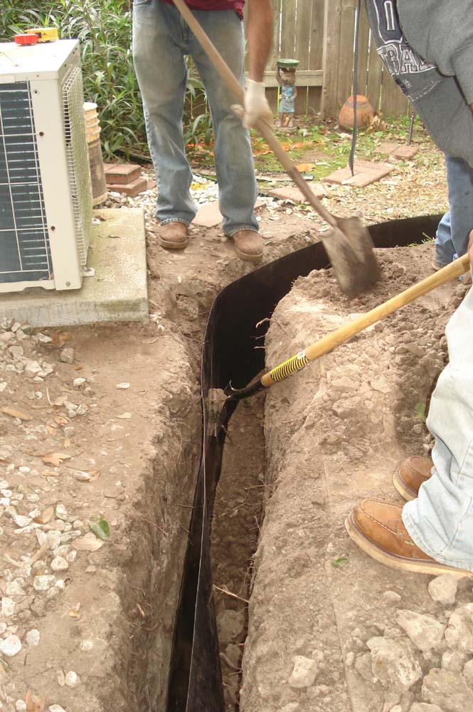 Back-Filling the Trench during a foundation repair job in Plano Texas