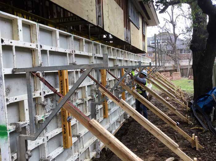 After the house is raised a foundation wall is built to provide support and enclose the area under the house.