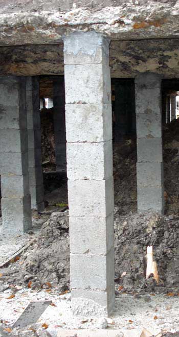 A single column of square concrete blocks is used by many foundation contractors for support after a house elevation.