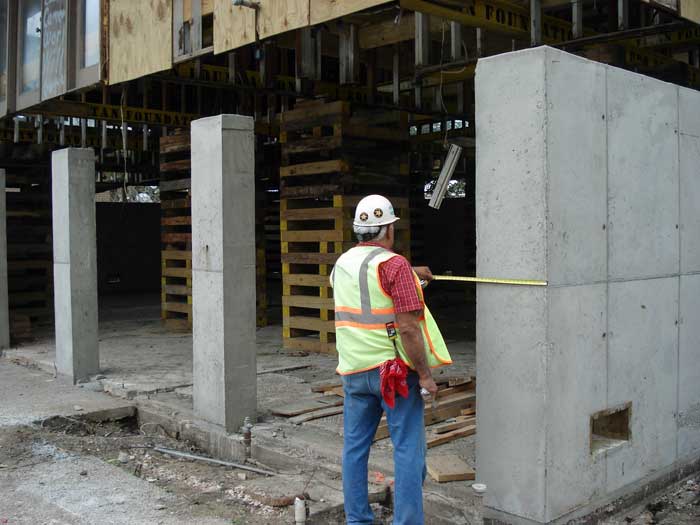 Newly built concrete columns and walls will support the house.