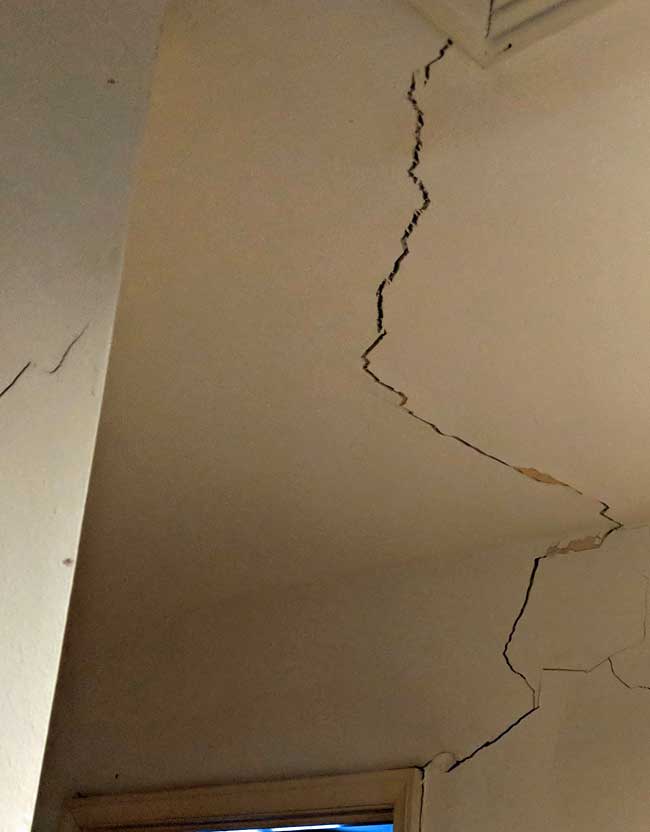 Interior sheetrock cracks strongly suggest that the foundation is experiencing stress from the movement of clay soils underneath.