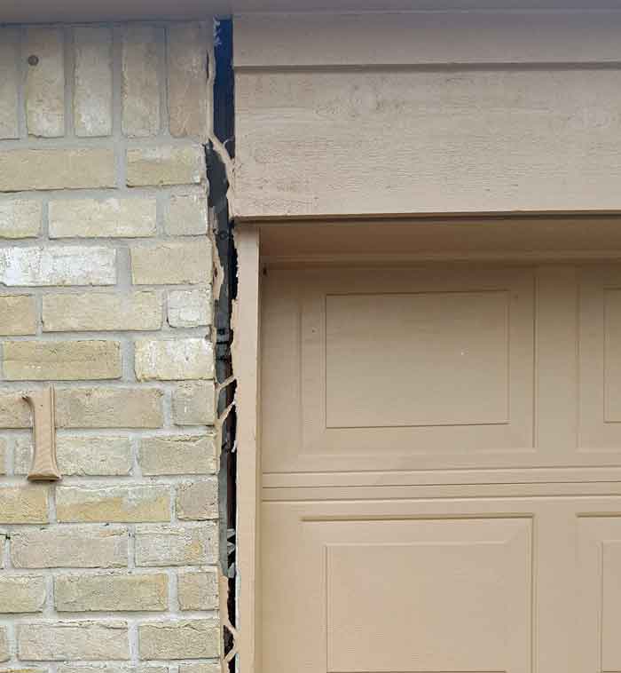 This Bay City area home is experiencing foundation movement which is pulling the brick wall from the garage frame.