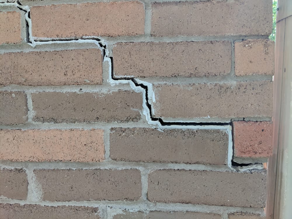 Exterior Brick Cracks are caused by the movement of the foundation's concrete slab.